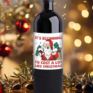 Detail showing a Christmas wine bottle label with a funny quote on a dark glass bottle