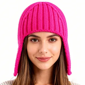 Rose pink knitted earflap beanie hat with ribbed texture for winter warmth