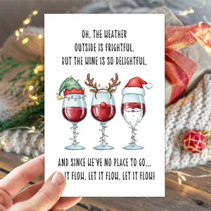 Close-up of festive Christmas card with wine glass illustrations and holiday gift decor