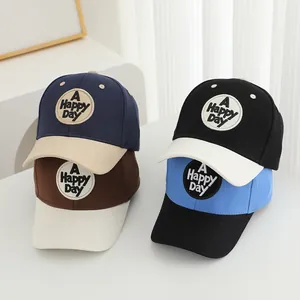 Embroidered letter baseball caps for kids in four color-block combinations