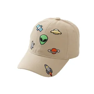 Khaki kids baseball cap featuring colorful alien and space embroidery on a white background