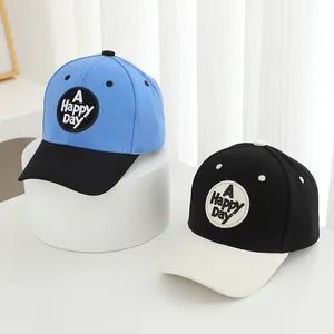 Kids baseball caps with 'A HAPPY DAY' embroidery in navy blue and black contrast colors