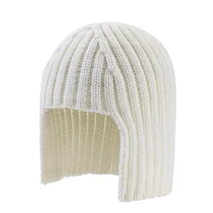 Detail of white rib-knit balaclava hat showing thick yarn texture and ear protection