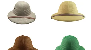 Detail of four colorful woven straw pith helmets with leather straps and metal air vents