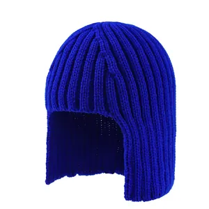 Macro view of blue ribbed knit ear-protection beanie with thick wool texture