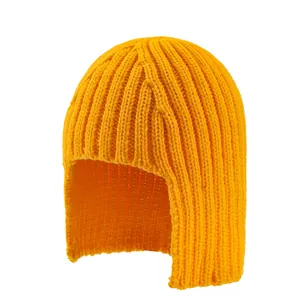 Detailed knit texture of a bright yellow winter beanie with protective ear flaps