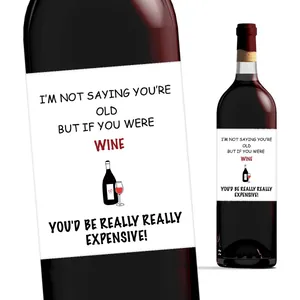 Macro detail of humor wine bottle labels with sleek typography and minimalist illustration