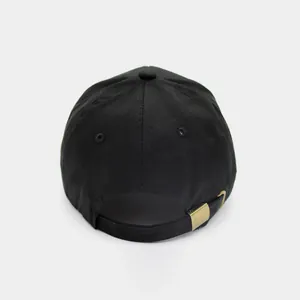 Rear view of black cotton baseball cap with adjustable antique brass buckle closure