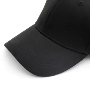 Minimalist black cotton baseball cap with premium stitching and solid color classic style