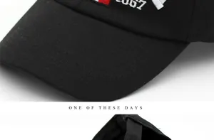 Detail of retro black baseball cap featuring 1987 embroidery and adjustable back strap