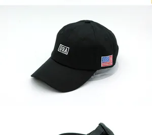 Detail of embroidered USA letters and American flag patch on a black baseball cap