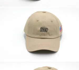 Detail of USA embroidery and American flag patch on khaki cotton baseball cap