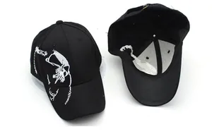 Detailed view of black baseball cap with white skull embroidery and inner construction