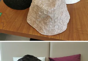 Detailed view of jacquard floral texture on pleated wide brim bucket hats in black and beige