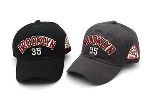 Close-up of Brooklyn 35 embroidery and vintage side patch on cotton baseball caps