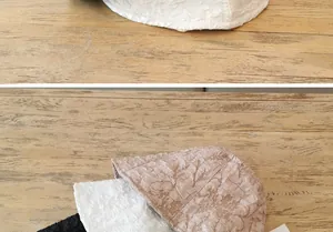 Detail showing pleated texture of lightweight sun hats in white, coffee, and black tones