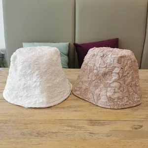 Chic pleated bucket hats in white and pink colors for summer outdoor sun protection