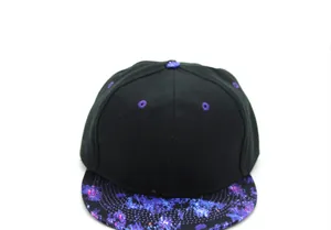 Detailed front view of a black snapback cap featuring a vibrant purple and blue galaxy print brim