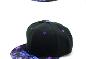 Detail of hip hop cap featuring purple galaxy print on the brim and black crown panels
