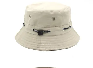 Close-up of beige outdoor hat featuring adjustable SPORT drawstring and metal eyelets