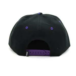 Black and purple snapback baseball cap featuring a starry print and adjustable plastic back strap