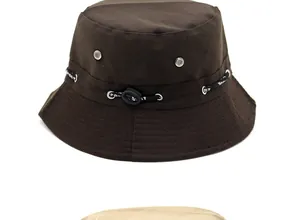 Detail view of dark brown bucket hat featuring metal eyelets and adjustable Sport drawstring