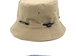Detail view of khaki bucket hat with adjustable SPORT strap and metal air vents