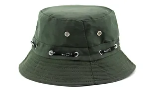 Detail of dark green sport bucket hat with metal eyelets and SPORT printed ribbon