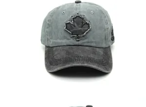 Detail of vintage washed cotton baseball cap with maple leaf patch and frayed edges