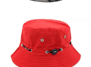 Detailed view of red canvas sun hat with adjustable black drawstring and reinforced stitching