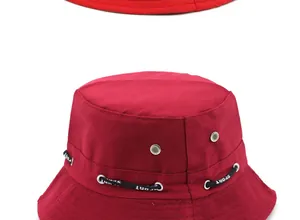 Detailed view of the dark red bucket hat with silver eyelets and SPORT cord