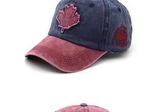 Detail of embroidered maple leaf patch and Canada logo on washed cotton baseball cap