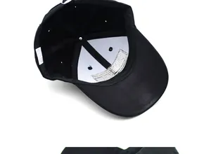 Detail view of cotton baseball cap interior featuring sweatband and care label