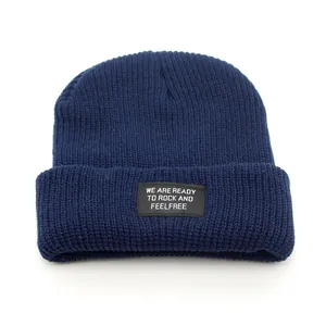 Navy blue ribbed knit beanie with a stylish letter patch for men and women