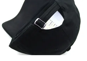Detail view of the black baseball cap showing the adjustable silver metal buckle and cotton fabric