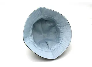 Close-up of camouflage sun hat showing reinforced stitching and light blue inner lining