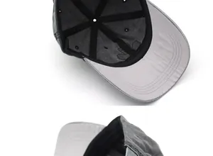 Detail of grey washed cotton baseball cap showing internal stitching and breathable eyelets