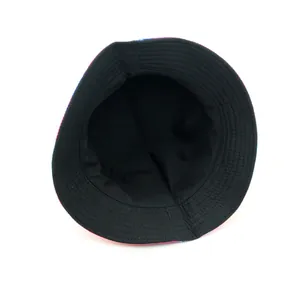 Inside view of a reversible tie-dye bucket hat with colorful abstract patterns on the brim