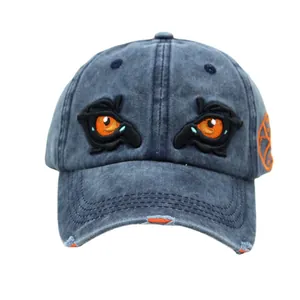 Distressed dark blue washed denim baseball cap with orange eagle eye embroidery