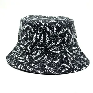 Detailed full-print bucket hat showing contrast black and white folk leaf patterns