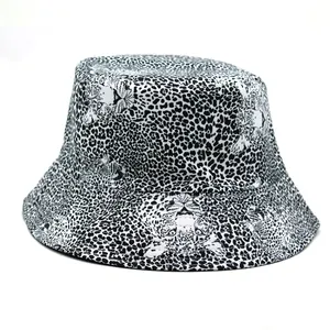 Detailed close-up of animal print bucket hat with black and white texture pattern