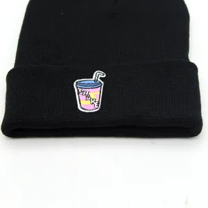 Black knit beanie with shake cup embroidery patch for warm autumn and winter style