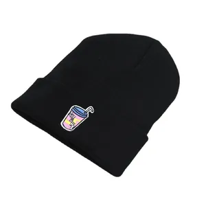 Black ribbed knit beanie with colorful shake drink cup embroidery on plain background
