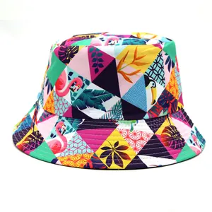 Detail of vibrant bucket hat featuring tropical flamingo palm leaves and geometric patterns