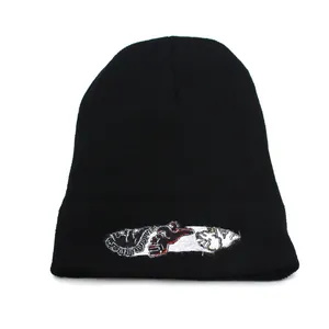 Black knit beanie with street-style embroidery and cuffed edge for winter warmth