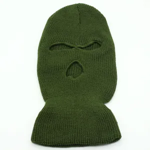 Detailed knit texture of olive green three-hole balaclava mask for winter protection