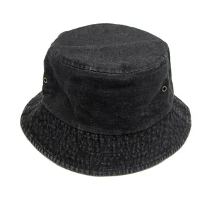Close-up of black washed denim bucket hat with metal ventilation eyelets and stitching