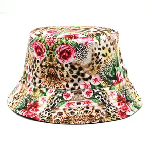 Detail of a bucket hat with unique leopard print and pink rose floral patterns on a white background