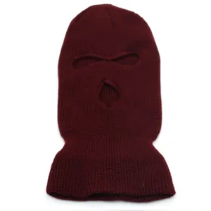 Detail view of burgundy 3-hole knitted balaclava with elastic weave for winter outdoor warmth