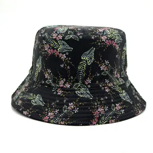 Detailed view of black bucket hat featuring delicate pink floral patterns and stitched brim